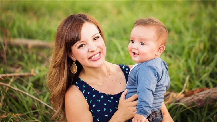 A parent and baby spending time together outdoors