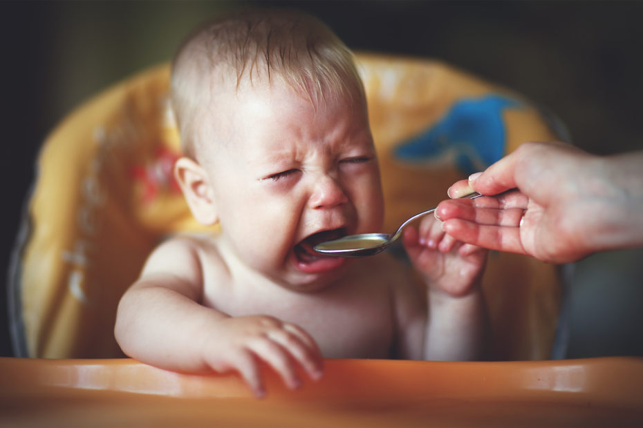 baby crying while being fed