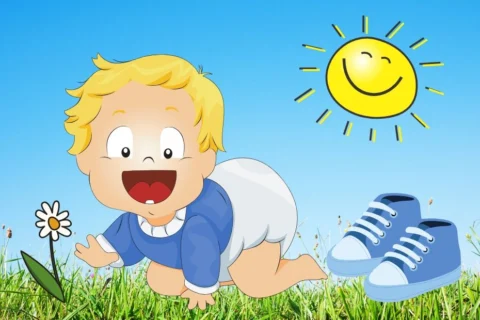 toddler crawling in grass with shoes