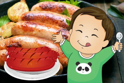 baby eating sausage