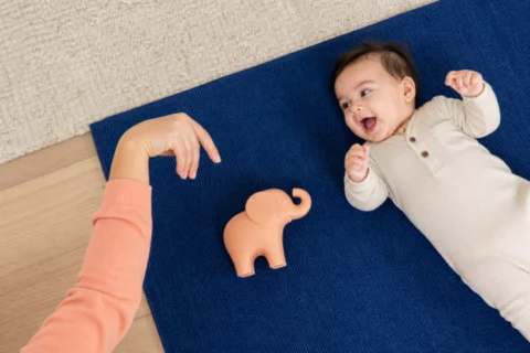 Editorial scene illustrating when your baby makes elephant noises: decoding baby sounds in a bright home setting.