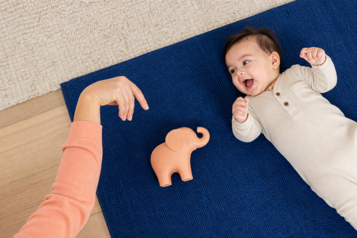 Editorial scene illustrating when your baby makes elephant noises: decoding baby sounds in a bright home setting.